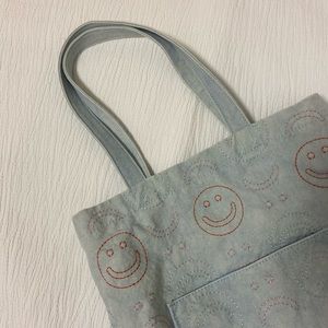 Urban Outfitters smile tote bag